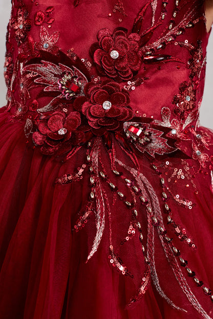 The Burgundy kids pageant dress has dimensional flowers and rhinestones.
