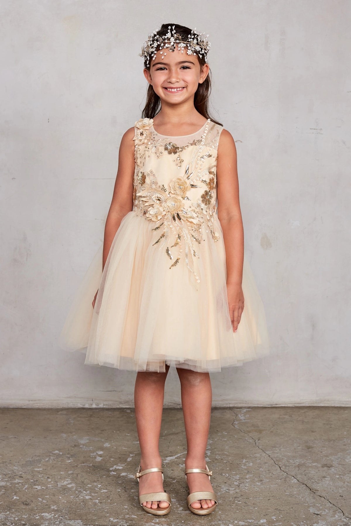 Gold kids pageant dress featuring dimensional floral embellishments.