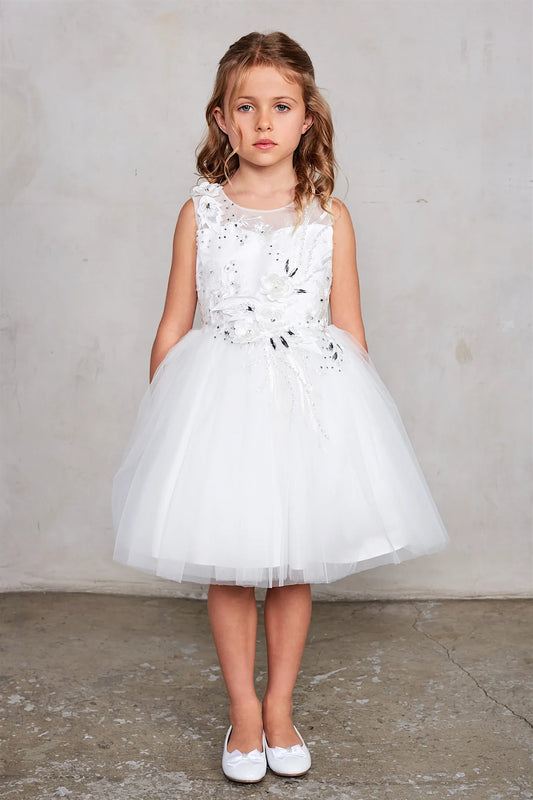 Dimensional flowers and sparkling accents decorate an ivory knee-length kids dress.