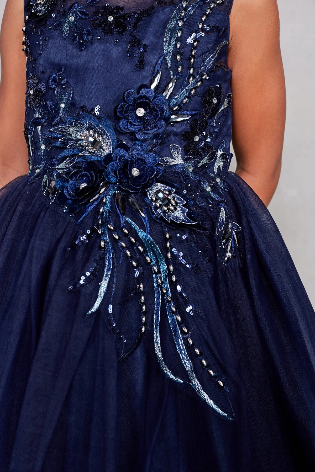 Visible details on the Navy Blue kids pageant dress include floral embroidery at the waist.