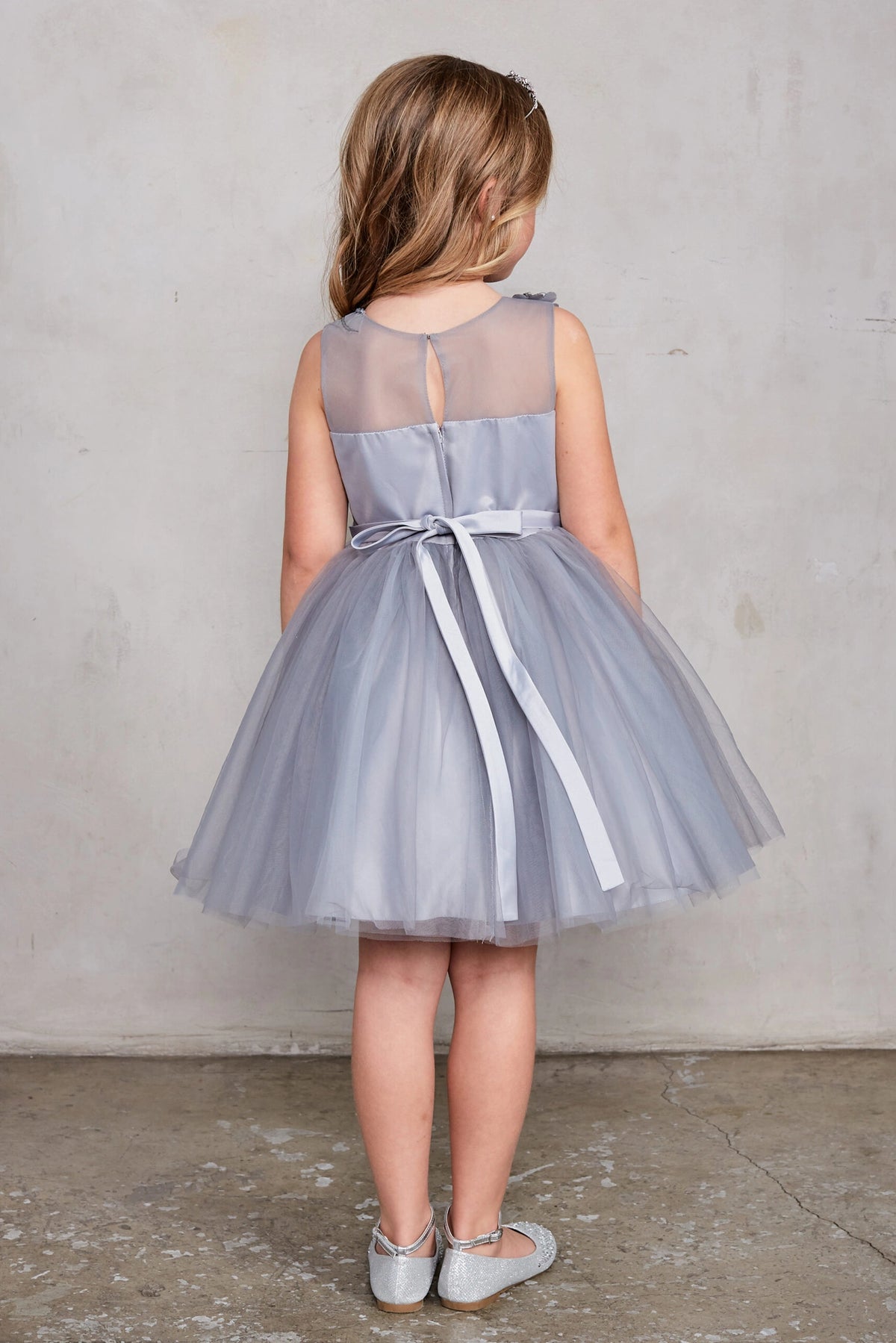 The Silver kids pageant dress has a tied sash across the back waist.