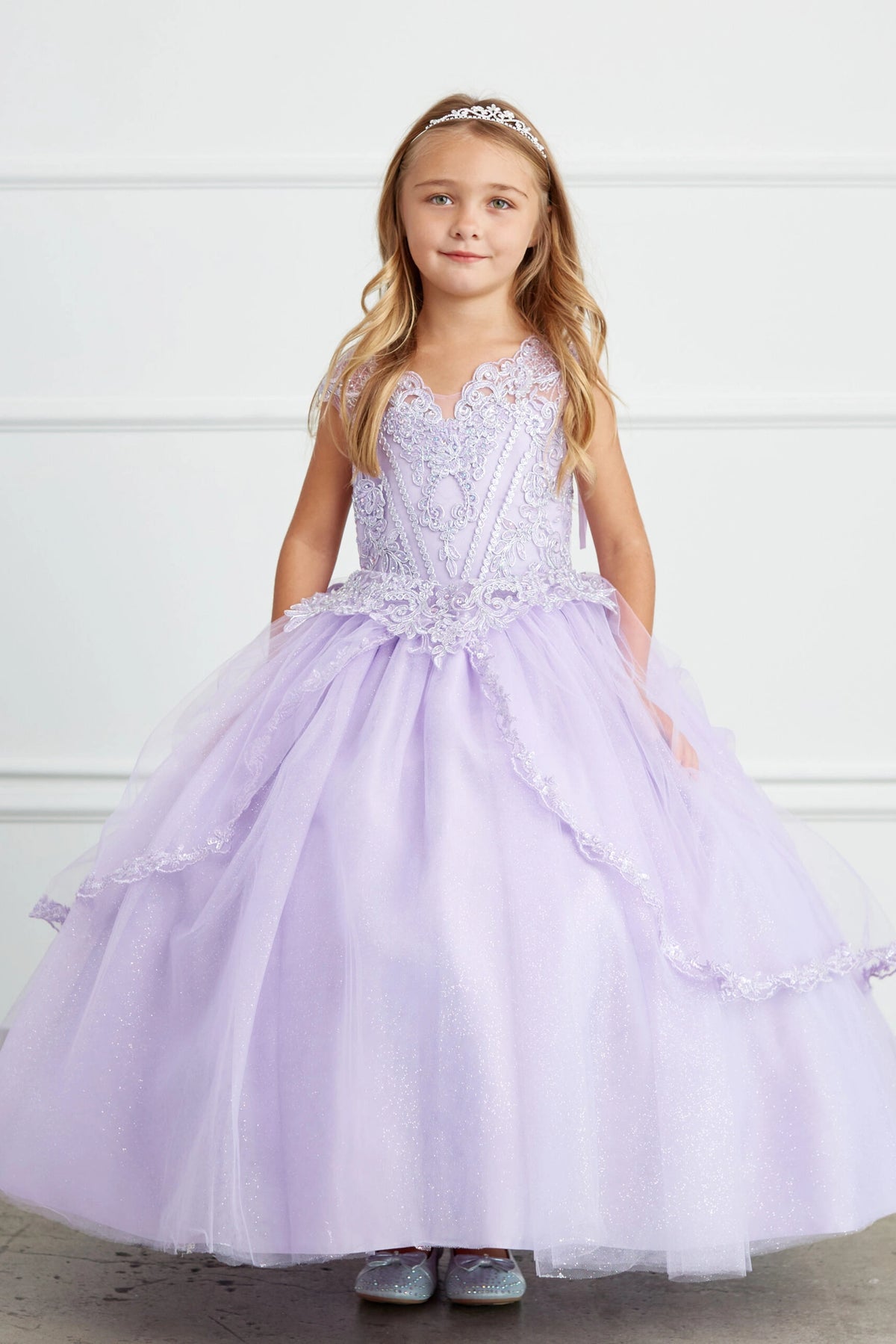 Lilac kids pageant dress featuring lace-trimmed layers of glitter tulle.