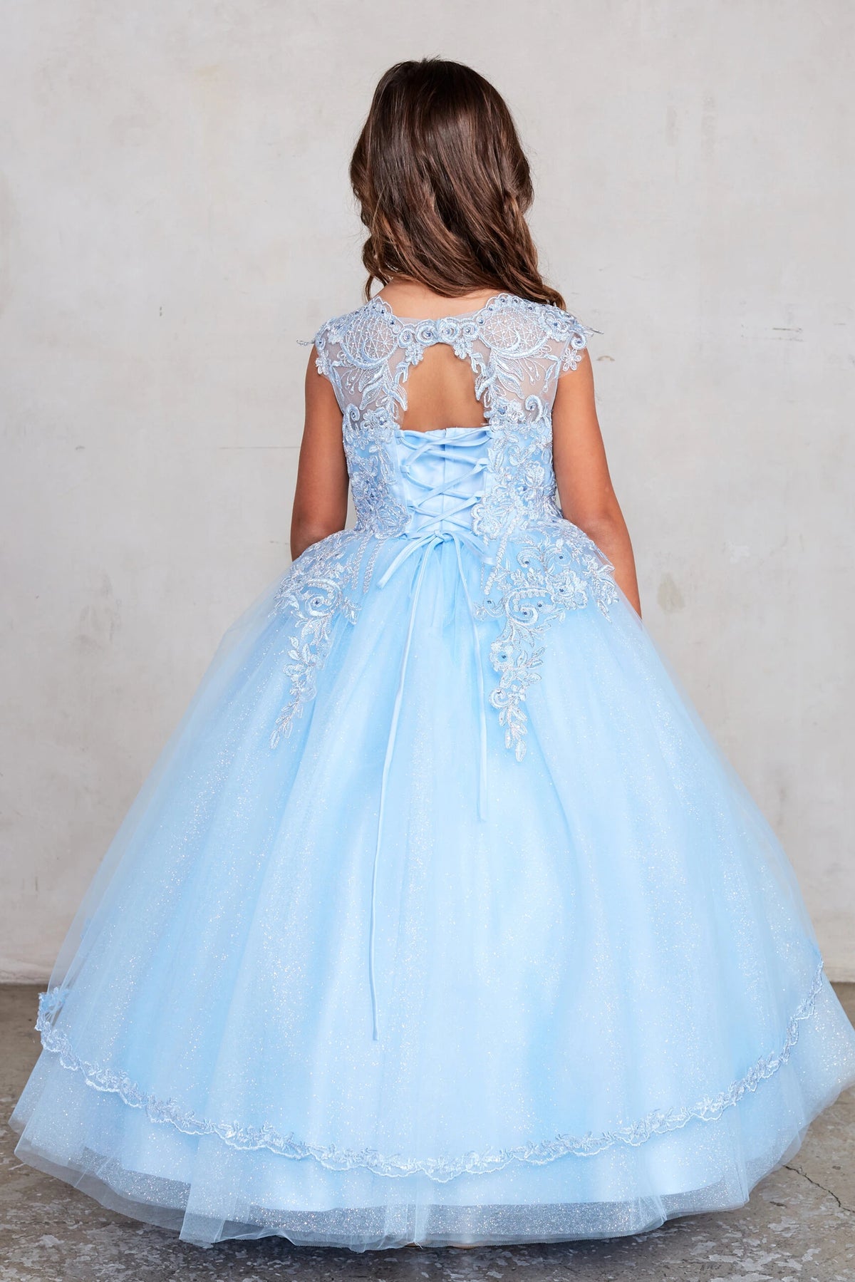 The Sky Blue kids pageant dress has a tied sash across the back waist.