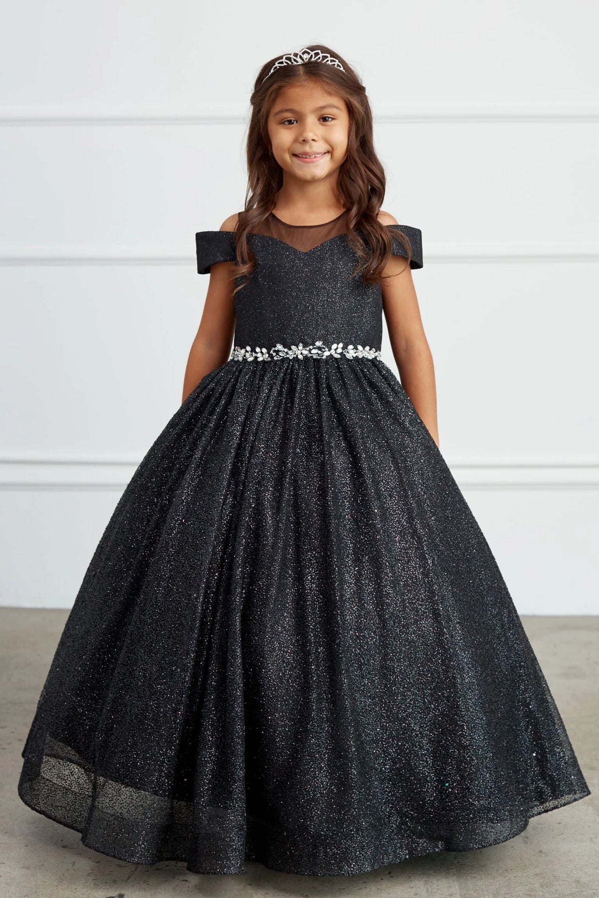 Black kids pageant dress featuring a rhinestone waist and glitter skirt.