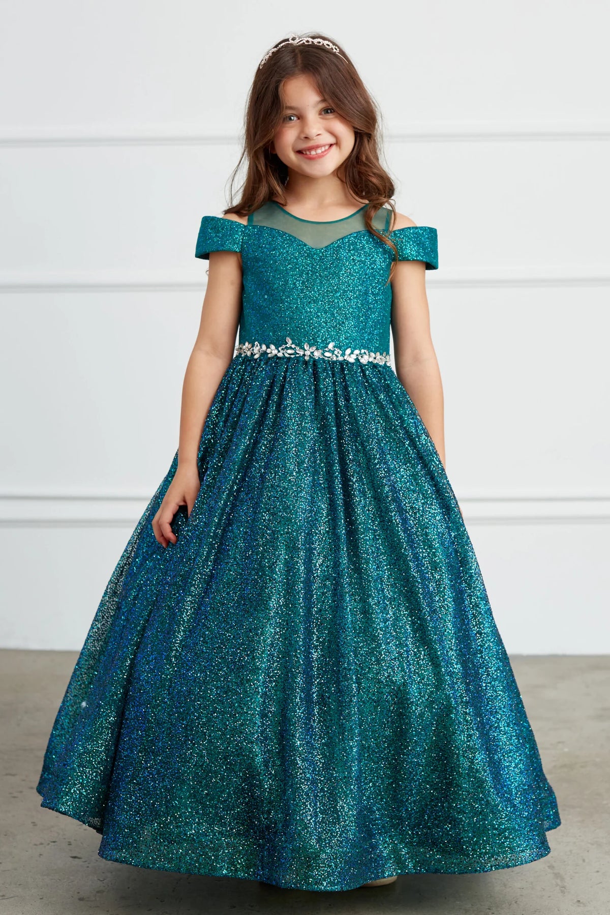 Emerald kids pageant dress featuring a rhinestone waist and glitter skirt.
