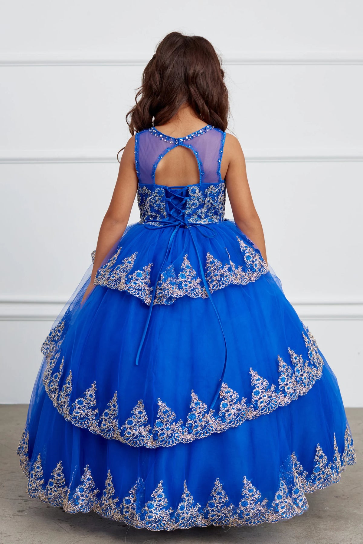 The Royal Blue kids pageant dress has lace-up ties at the back.