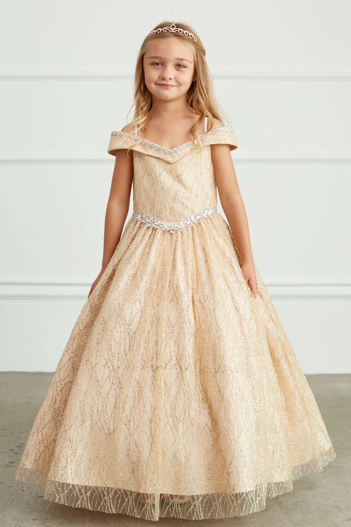 Gold kids pageant dress featuring a beaded waist and glitter mesh.
