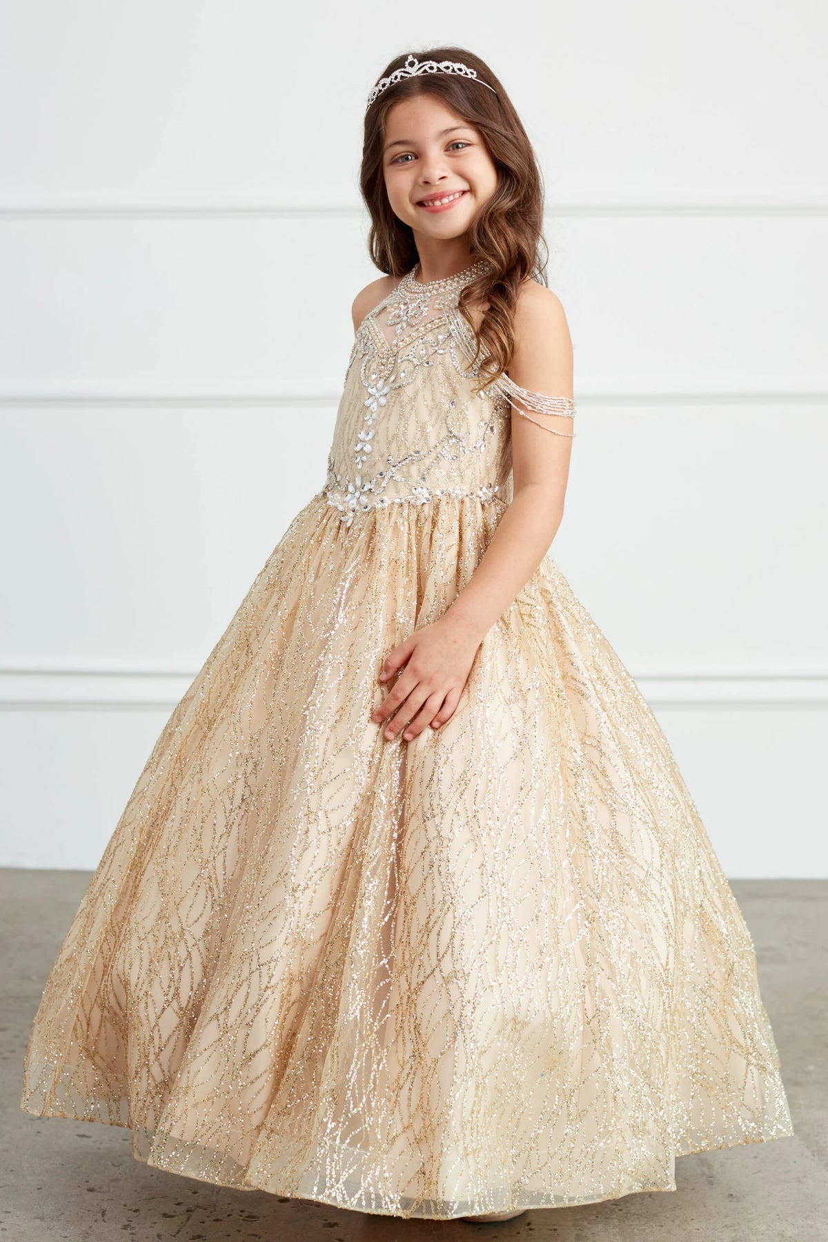 The Gold kids pageant dress has lace-up ties at the back.