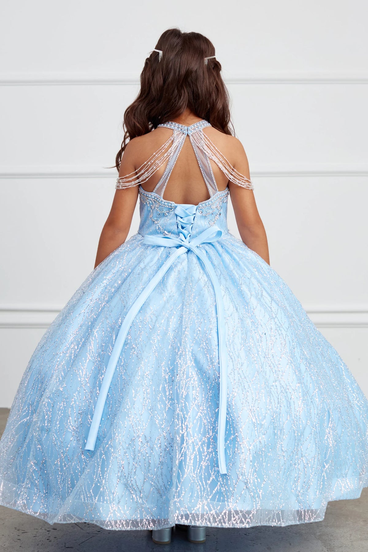 Seen from behind, this Sky Blue kids pageant dress displays lace-up ties at the back.
