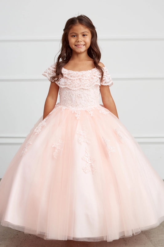 Blush kids pageant dress featuring a ruffled off-the-shoulder neckline.