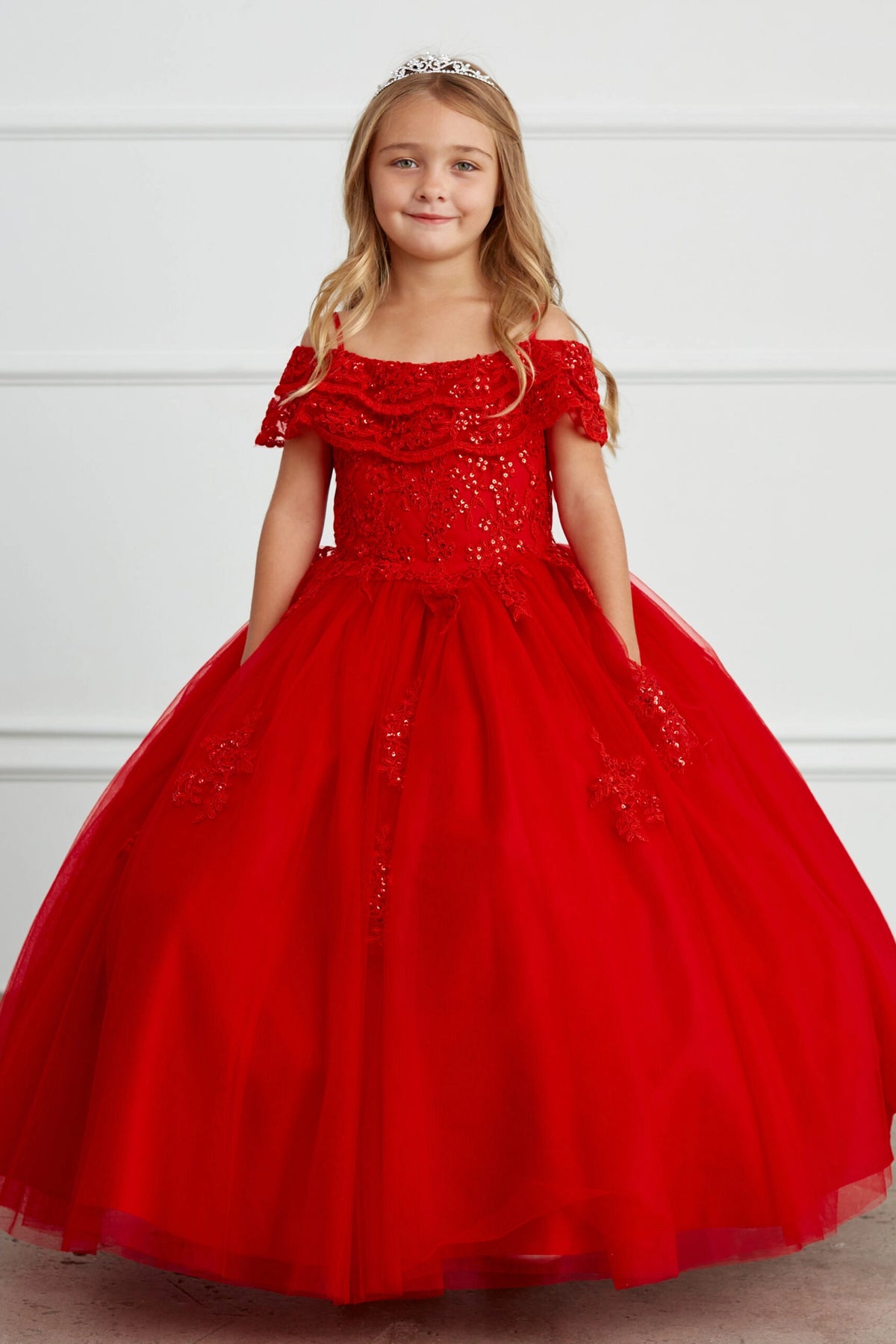 Red kids pageant dress featuring a ruffled off-the-shoulder neckline.