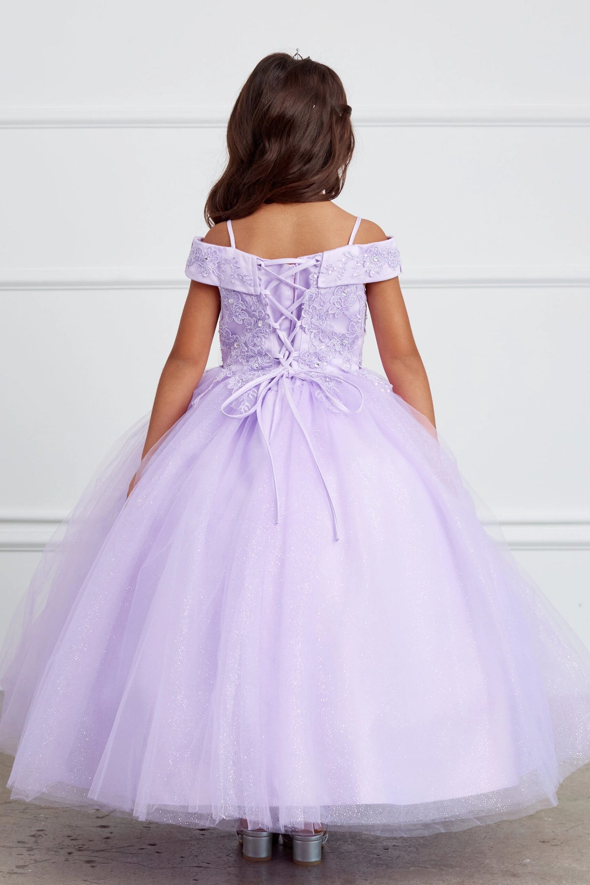 The Lilac kids pageant dress has a tied sash across the back waist.
