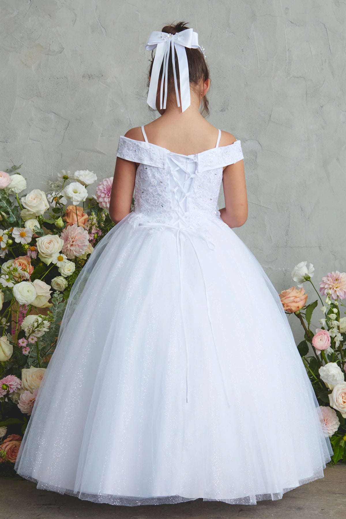 Another view of the White kids pageant dress shows a tied sash across the back waist.