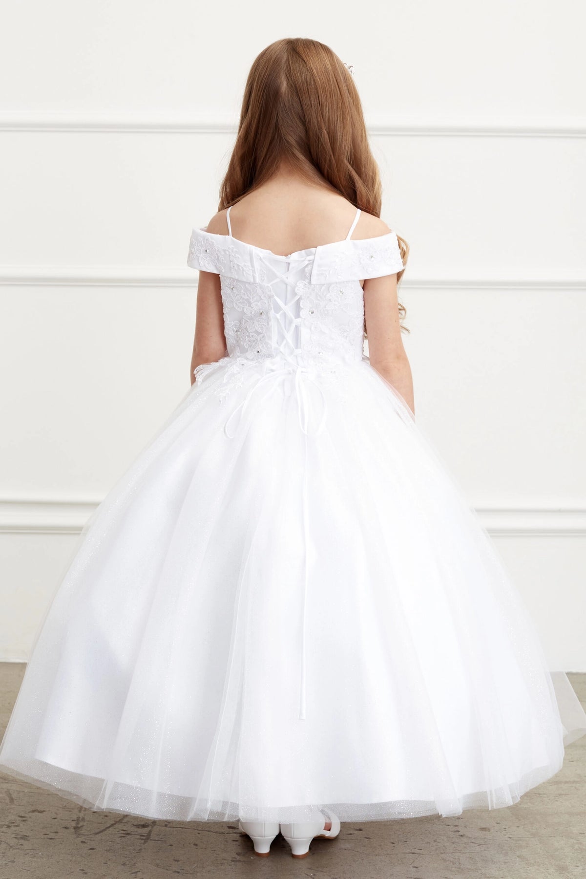 Look at a tied sash across the back waist on this White kids pageant dress.