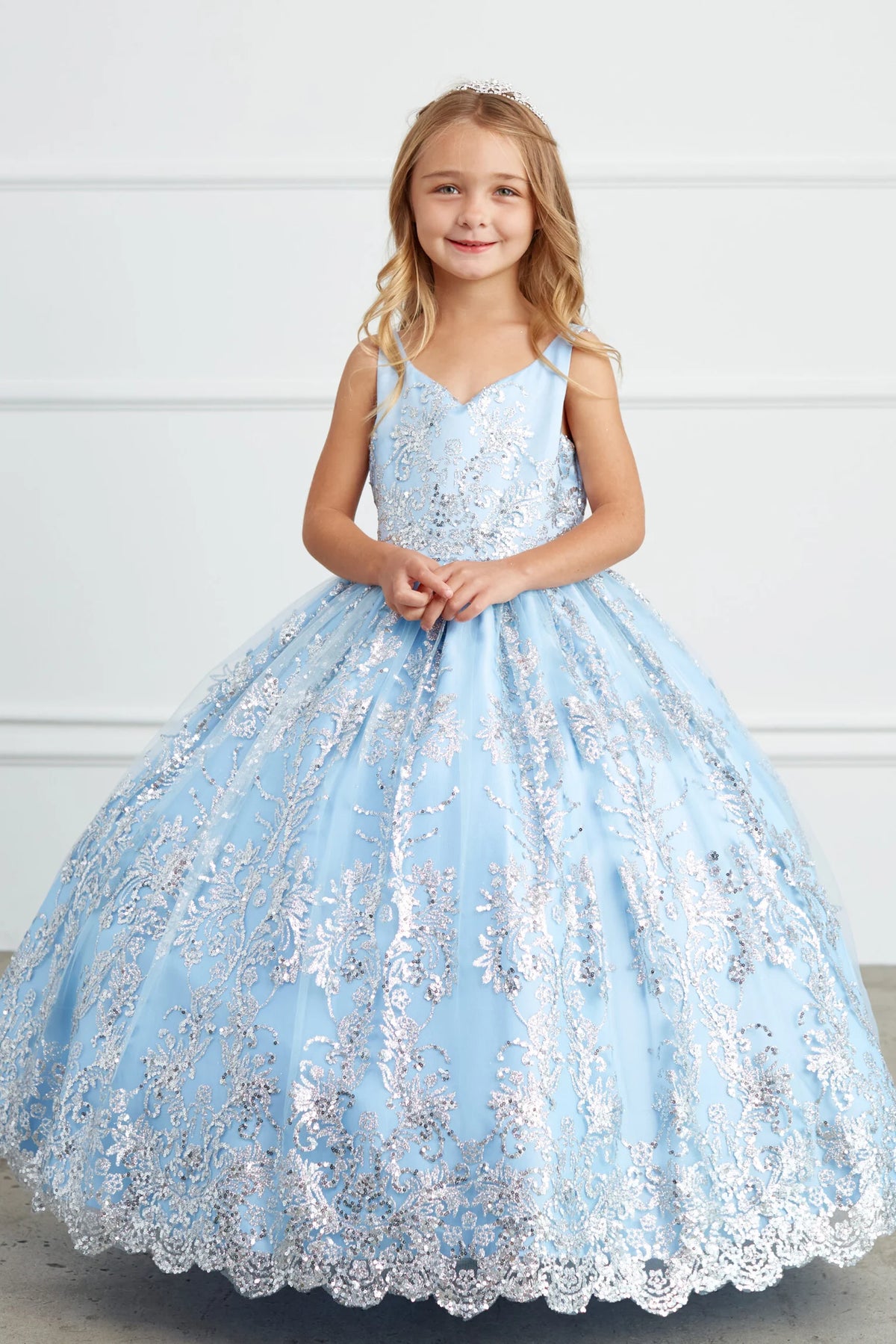 The Dusty Blue kids pageant dress has floral glitter lace.