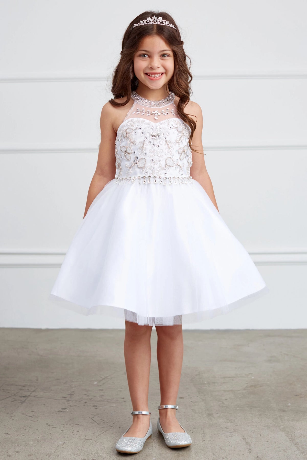 White kids pageant dress featuring a rhinestone-trimmed choker neckline.