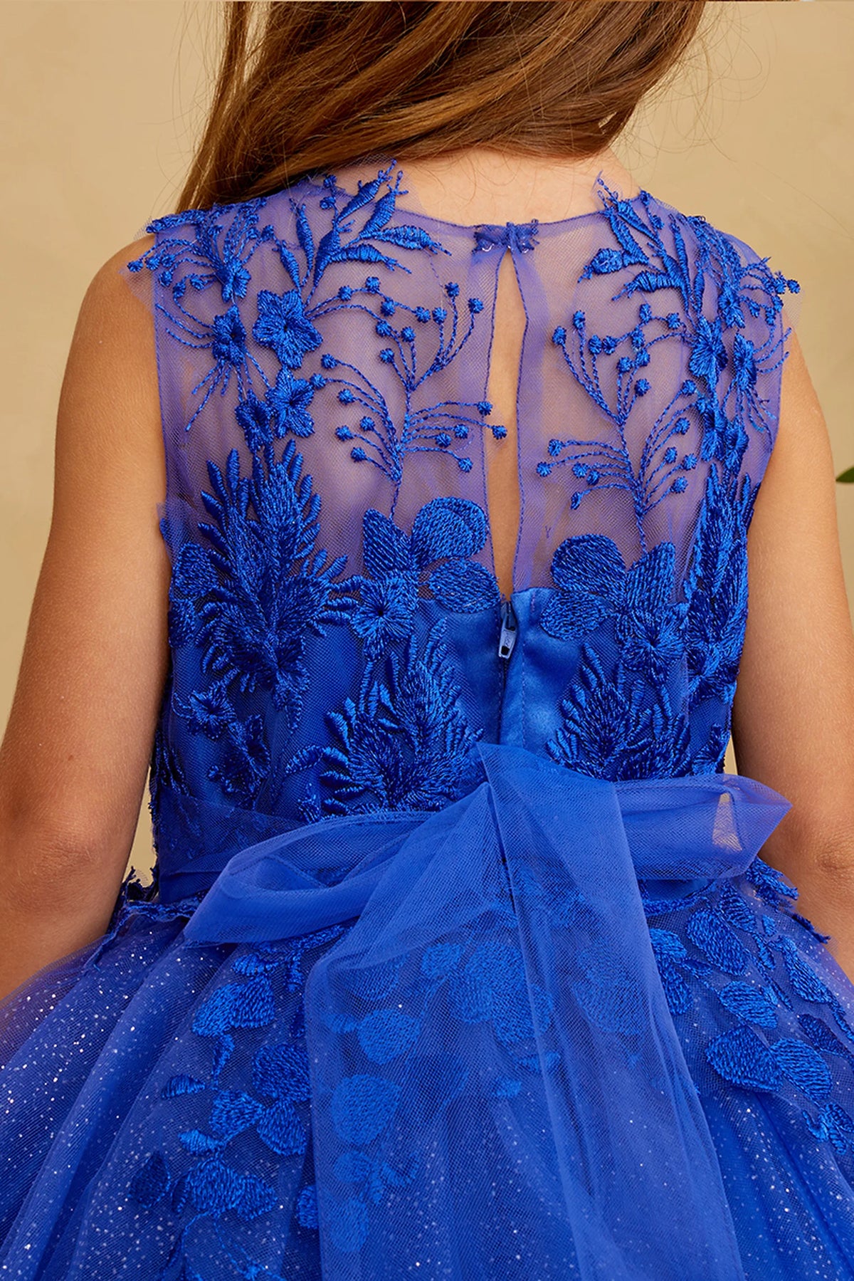 The Royal Blue kids pageant dress has floral lace on the sheer back.