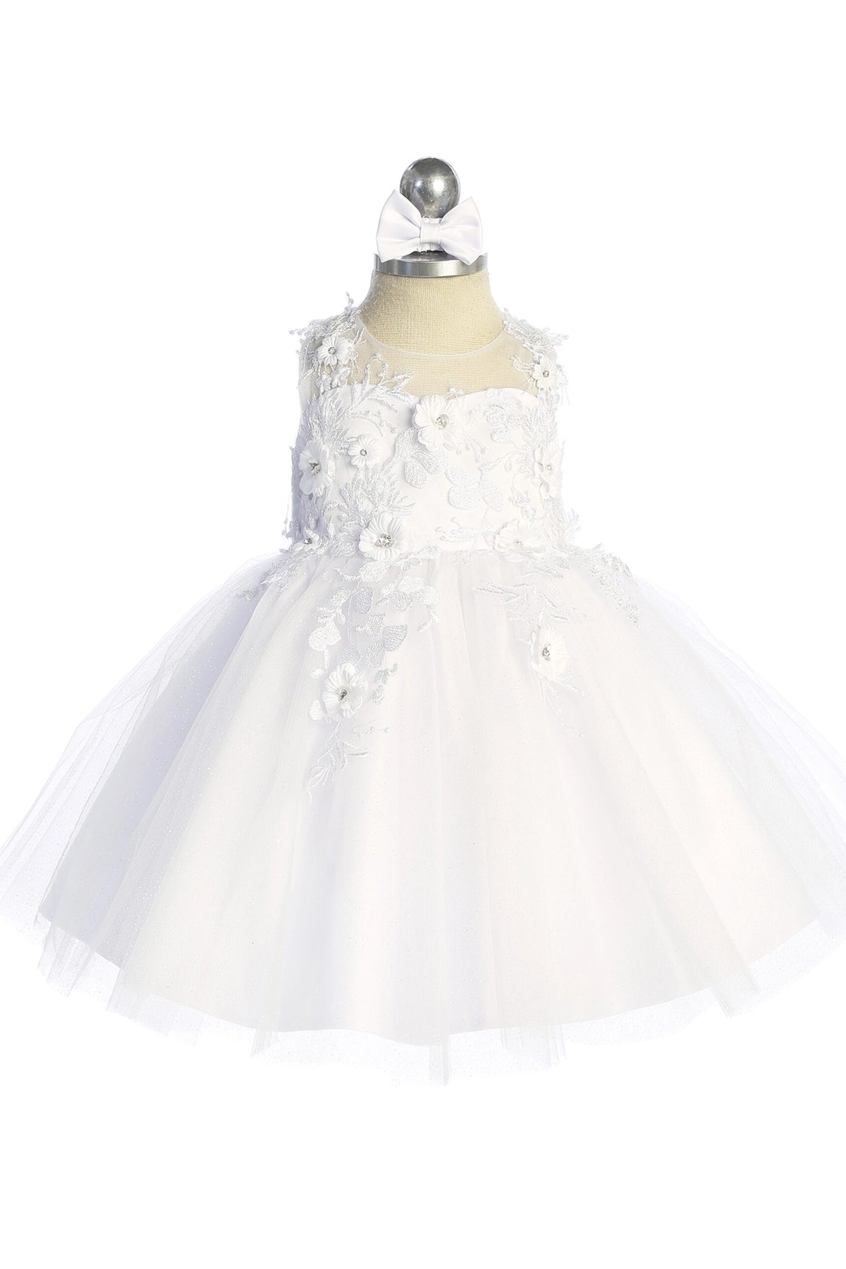 The White kids pageant dress has dimensional floral lace.