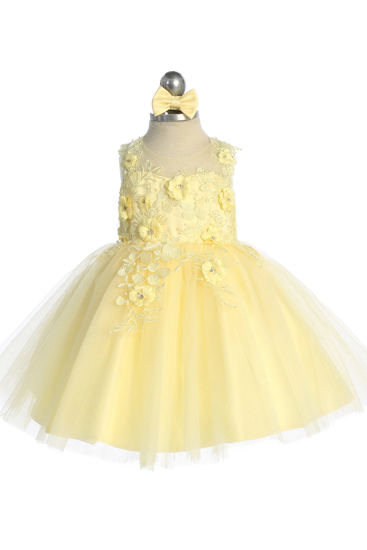 The Yellow kids pageant dress has dimensional floral lace.