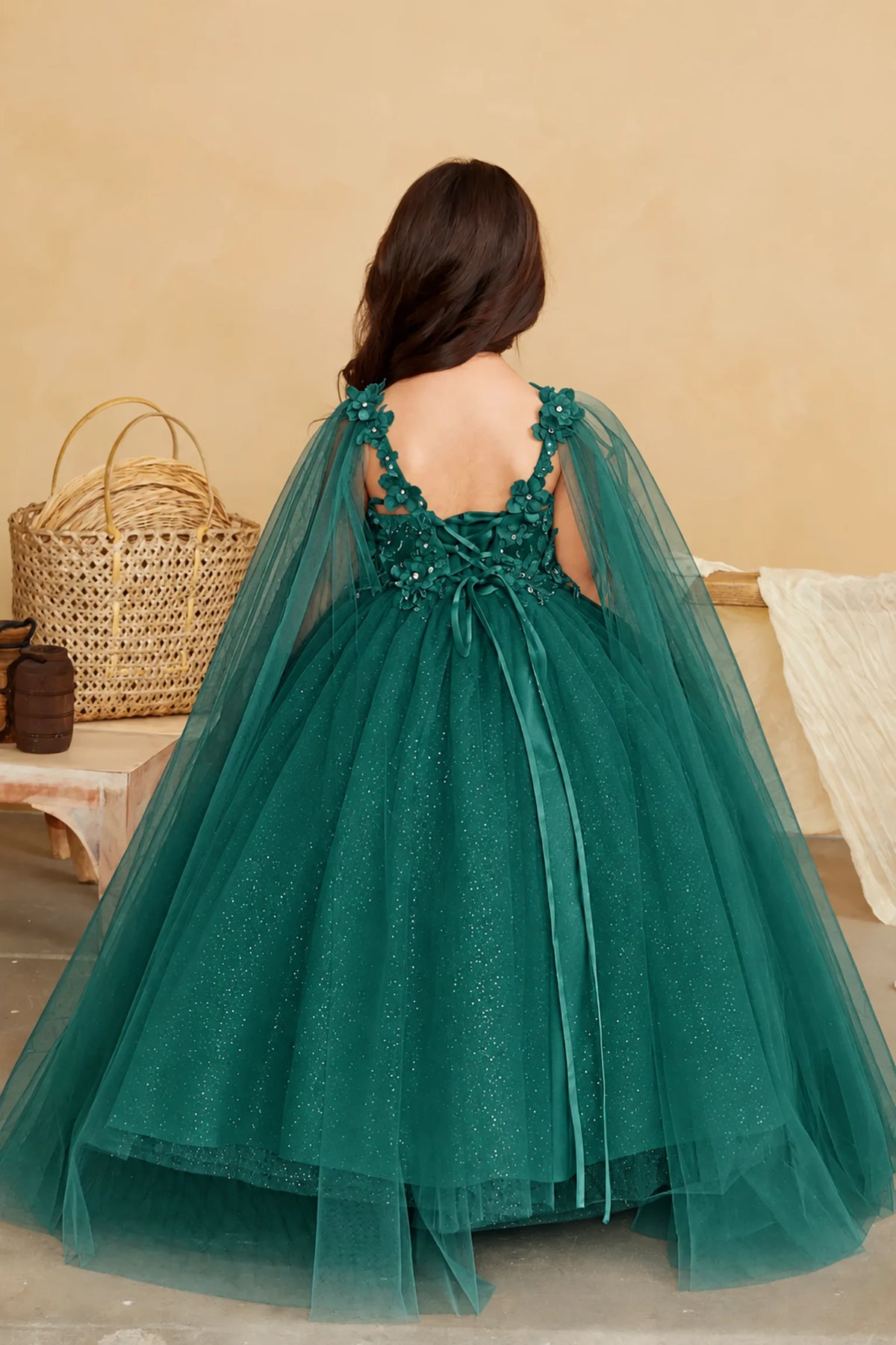 Glitter tulle forms the full skirt of the Hunter Green (Emerald) mini quince dress.