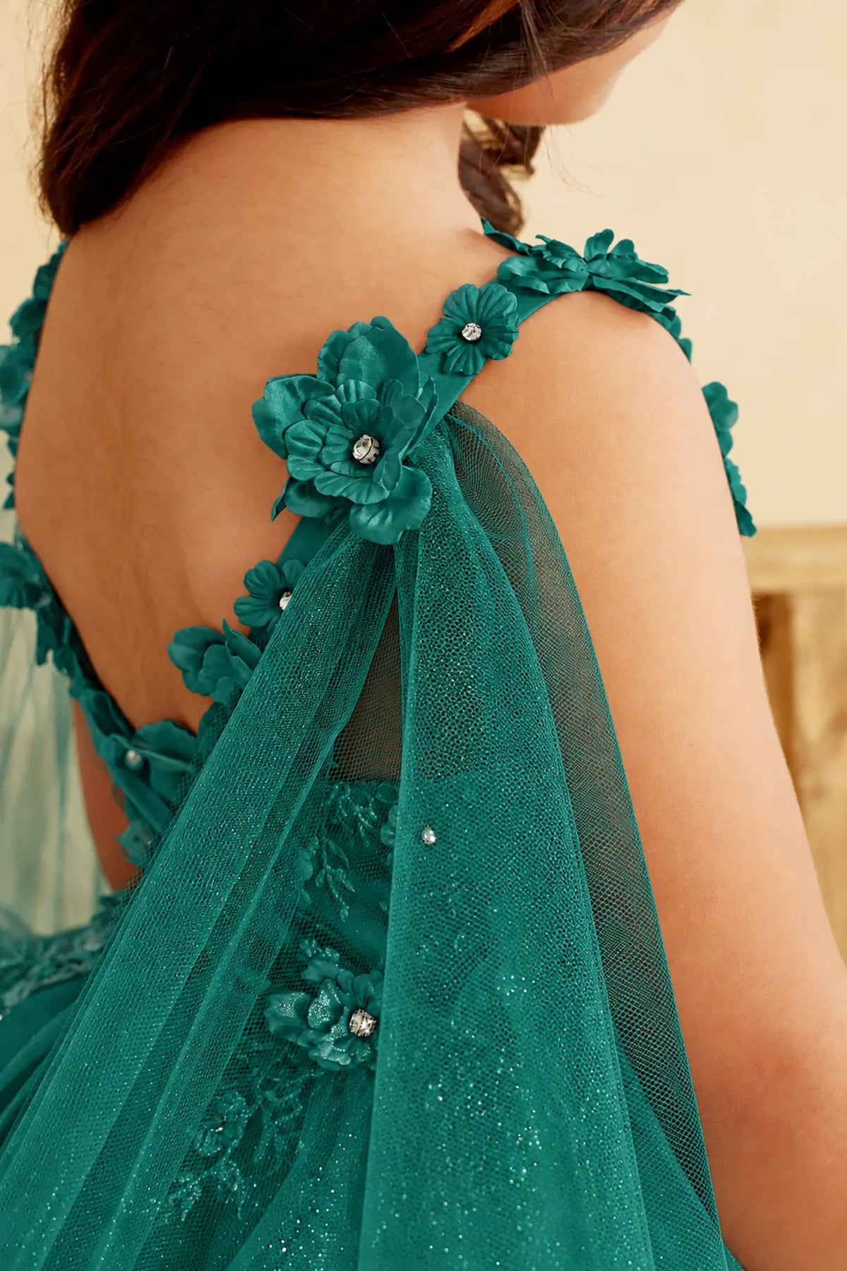 Jeweled flowers edge the sheer cape of this Hunter Green (Emerald) mini quince dress.