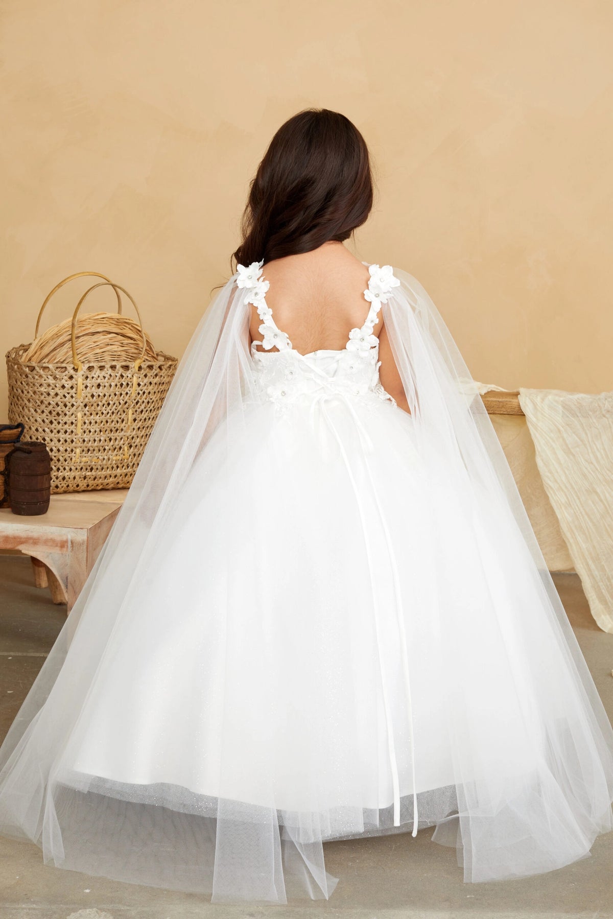 The Ivory kids pageant dress has a tied sash across the back waist.