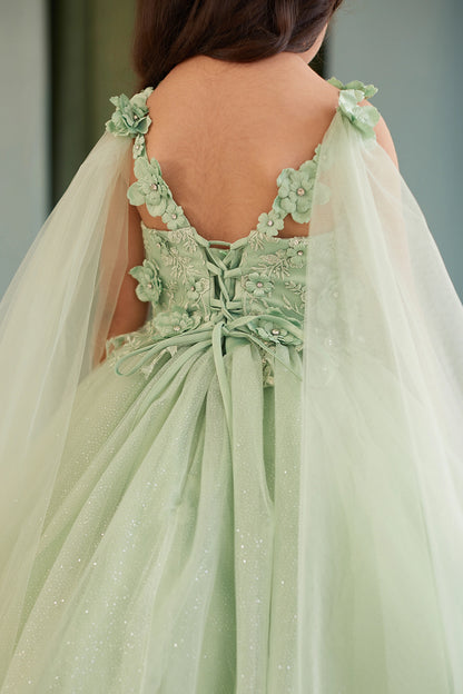 Seen from the front, this Sage kids pageant dress displays floral appliques on a full tulle skirt.