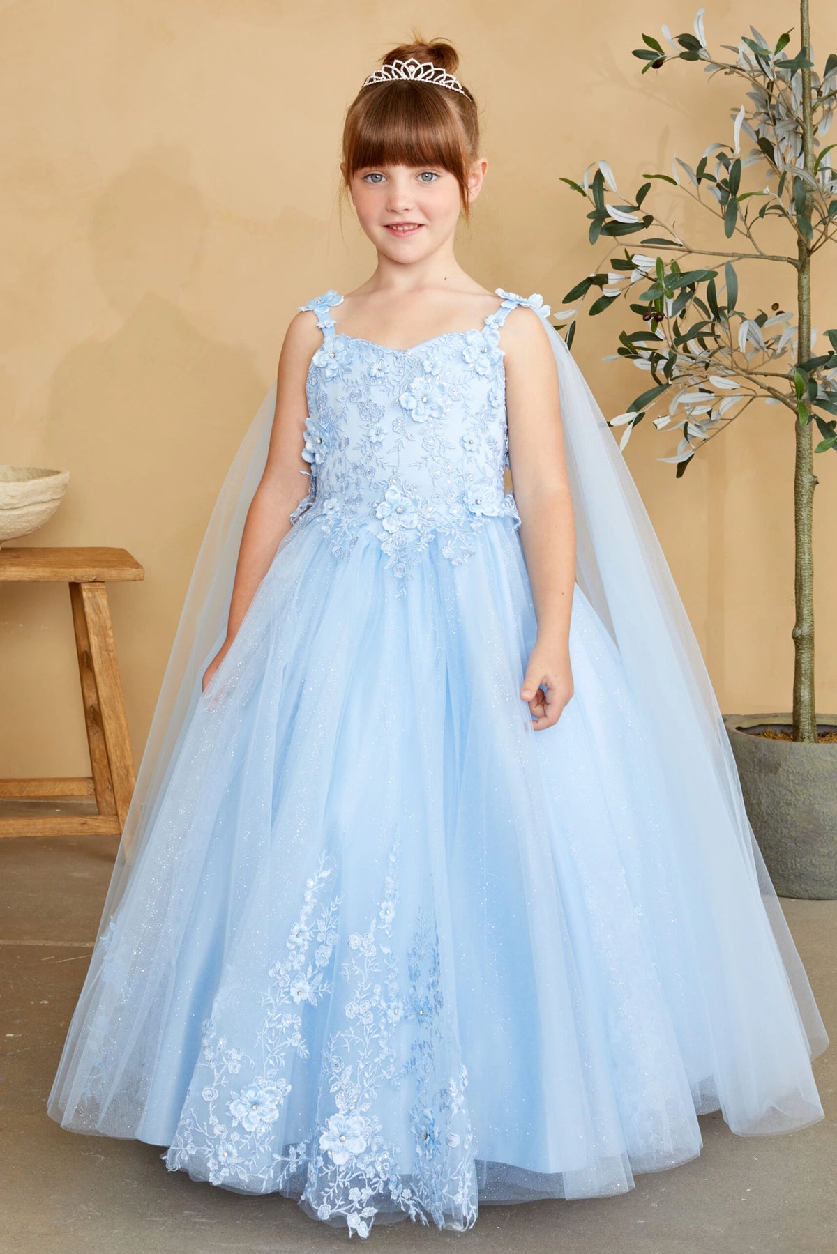 Visible details on the Sky Blue kids pageant dress include floral appliques on a full tulle skirt.