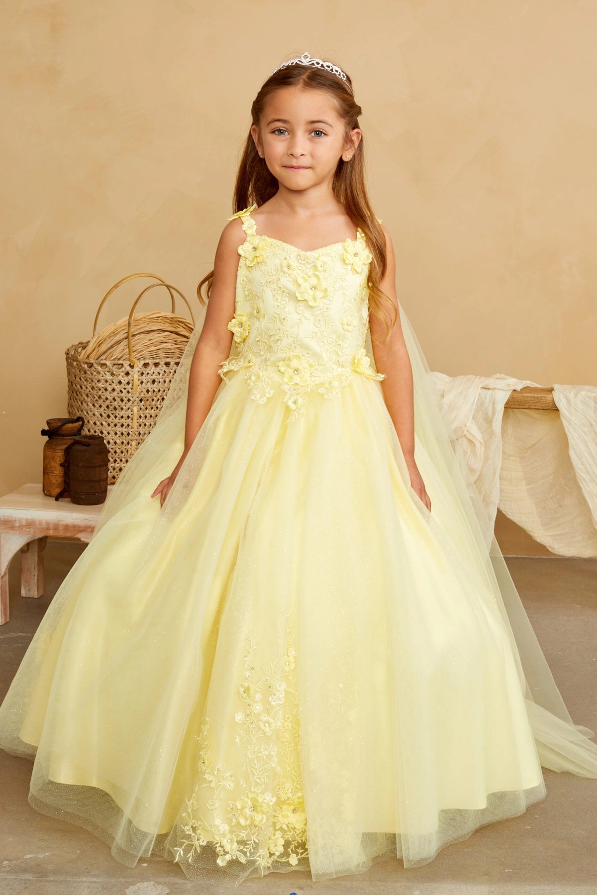 Yellow kids pageant dress featuring floral appliques on a full tulle skirt.