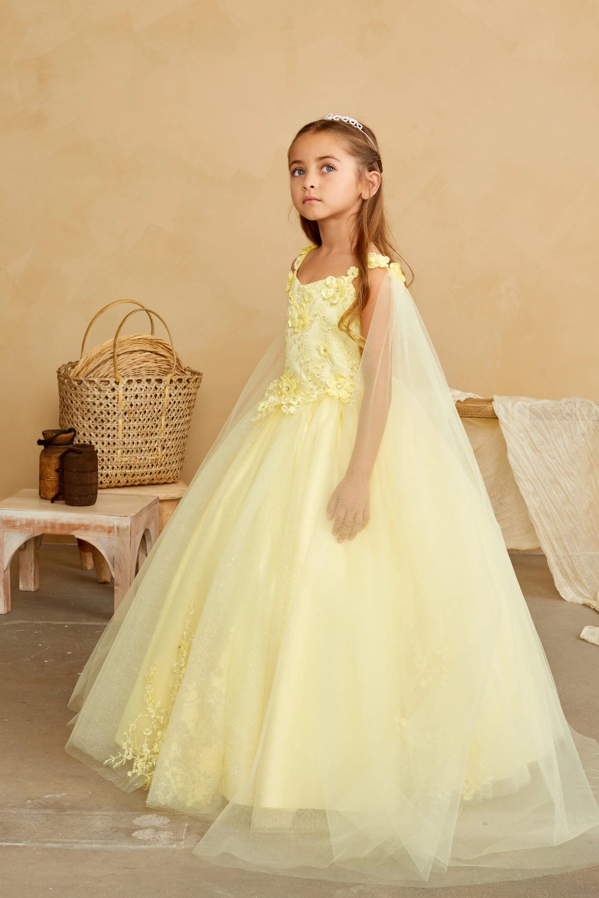 Visible details on the Yellow kids pageant dress include floral appliques on a full tulle skirt.