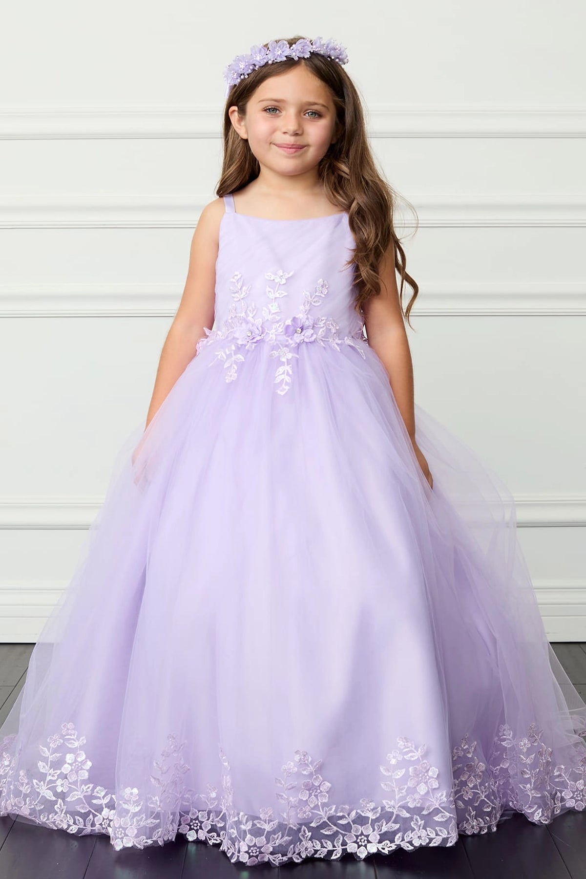 Lilac kids pageant dress featuring lace trimming along a flowing train.
