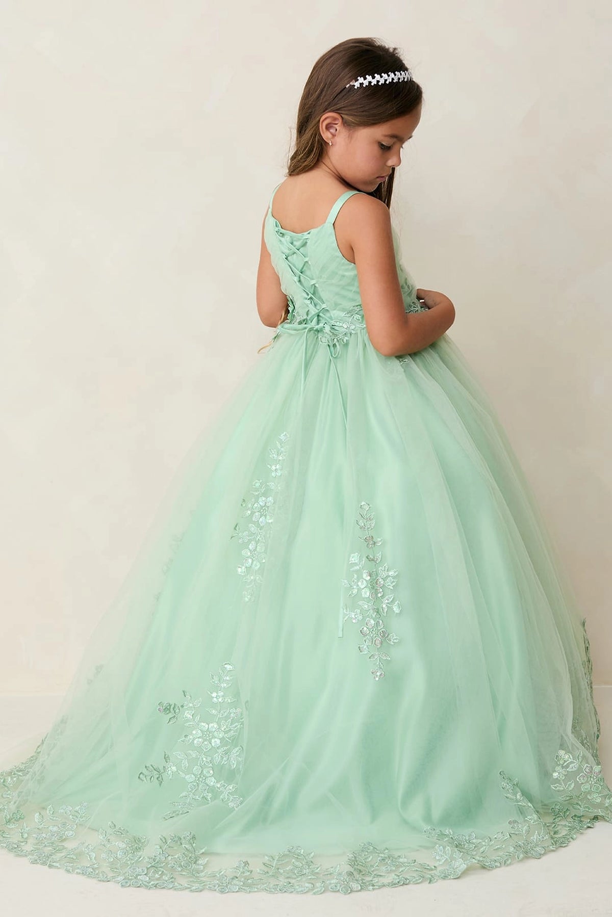 The Sage kids pageant dress has lace-up ties at the back.