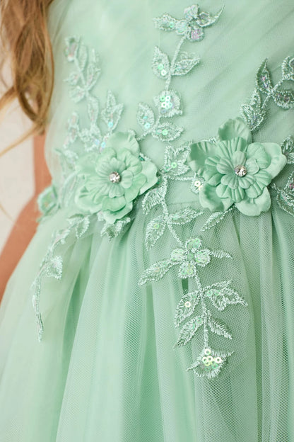 Visible details on the Sage kids pageant dress include lace appliques down the skirt.