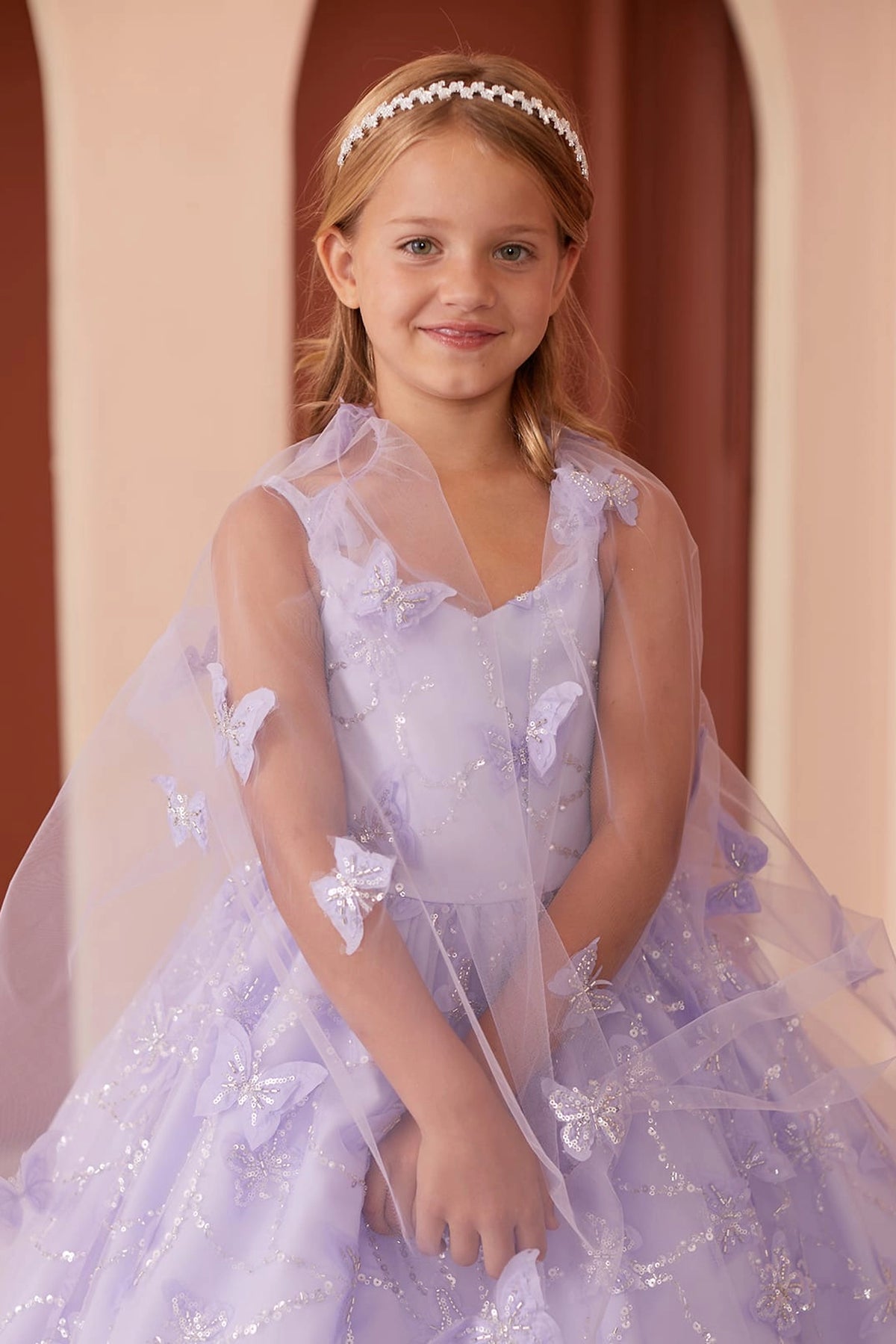 Visible details on the Lilac kids pageant dress include butterflies above the waist.