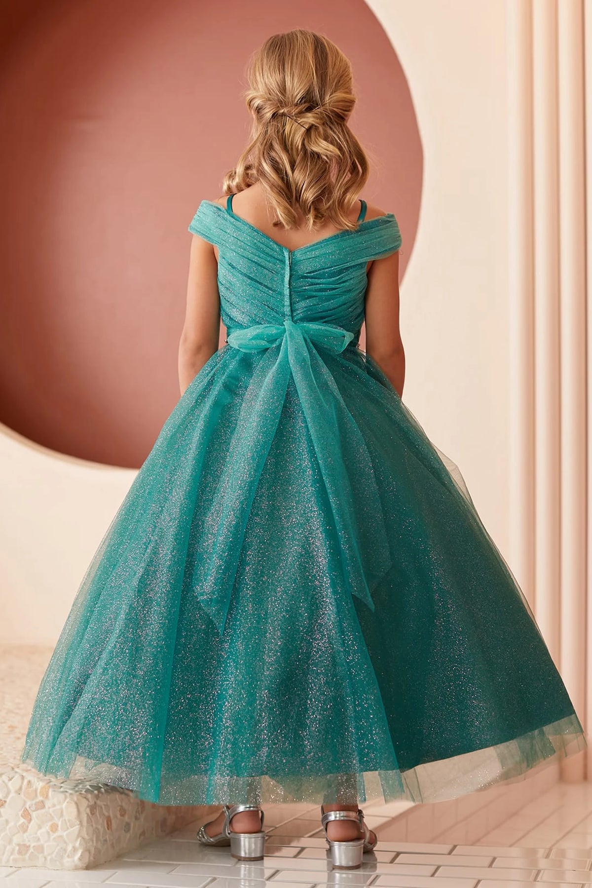 The Emerald kids pageant dress has a tied sash across the back waist.