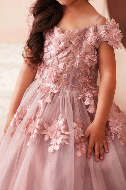 In view: 3D flower appliques of a dusty rose mini quince dress.