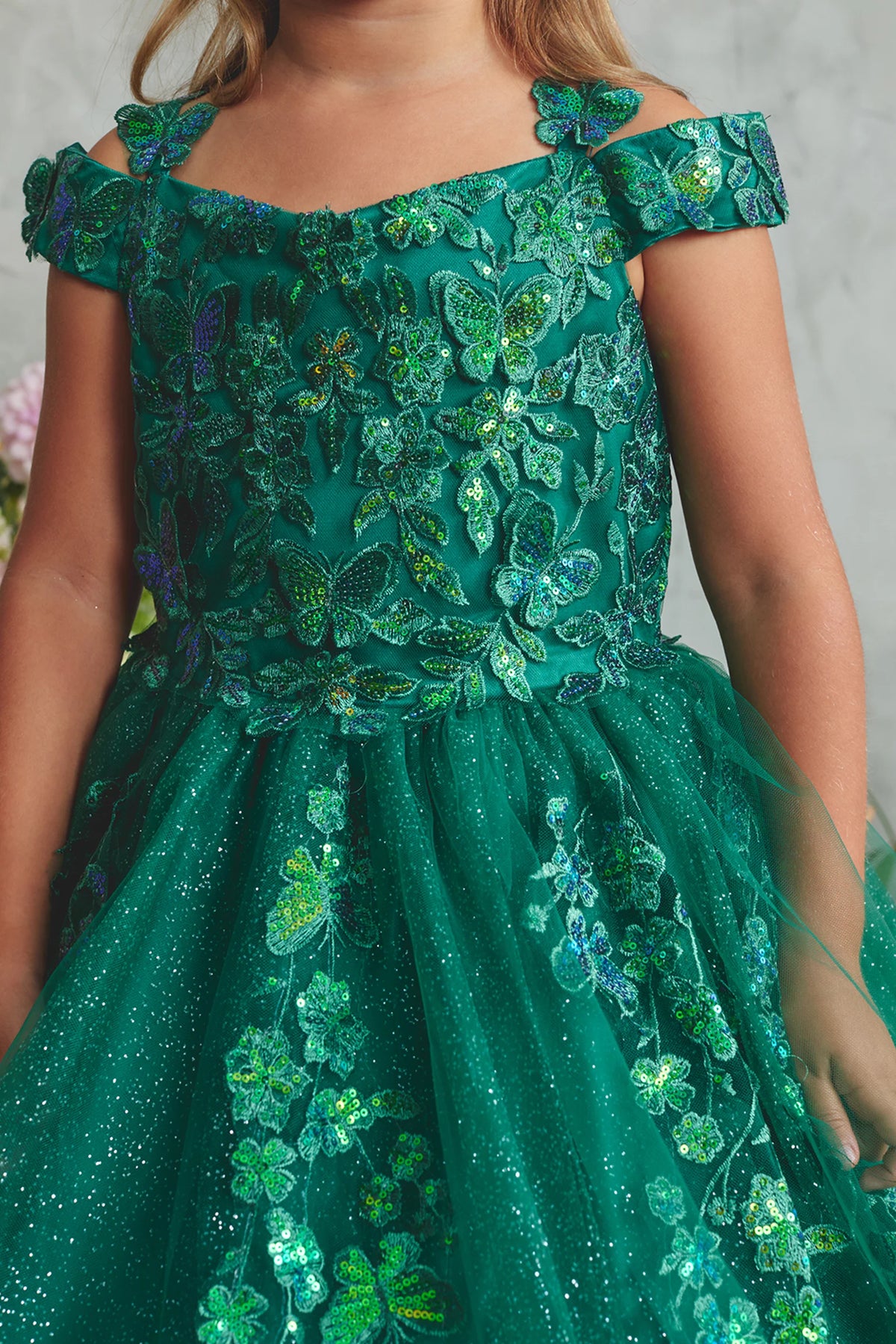 Visible details on the Emerald kids pageant dress include floral lace and sequins at the neckline.