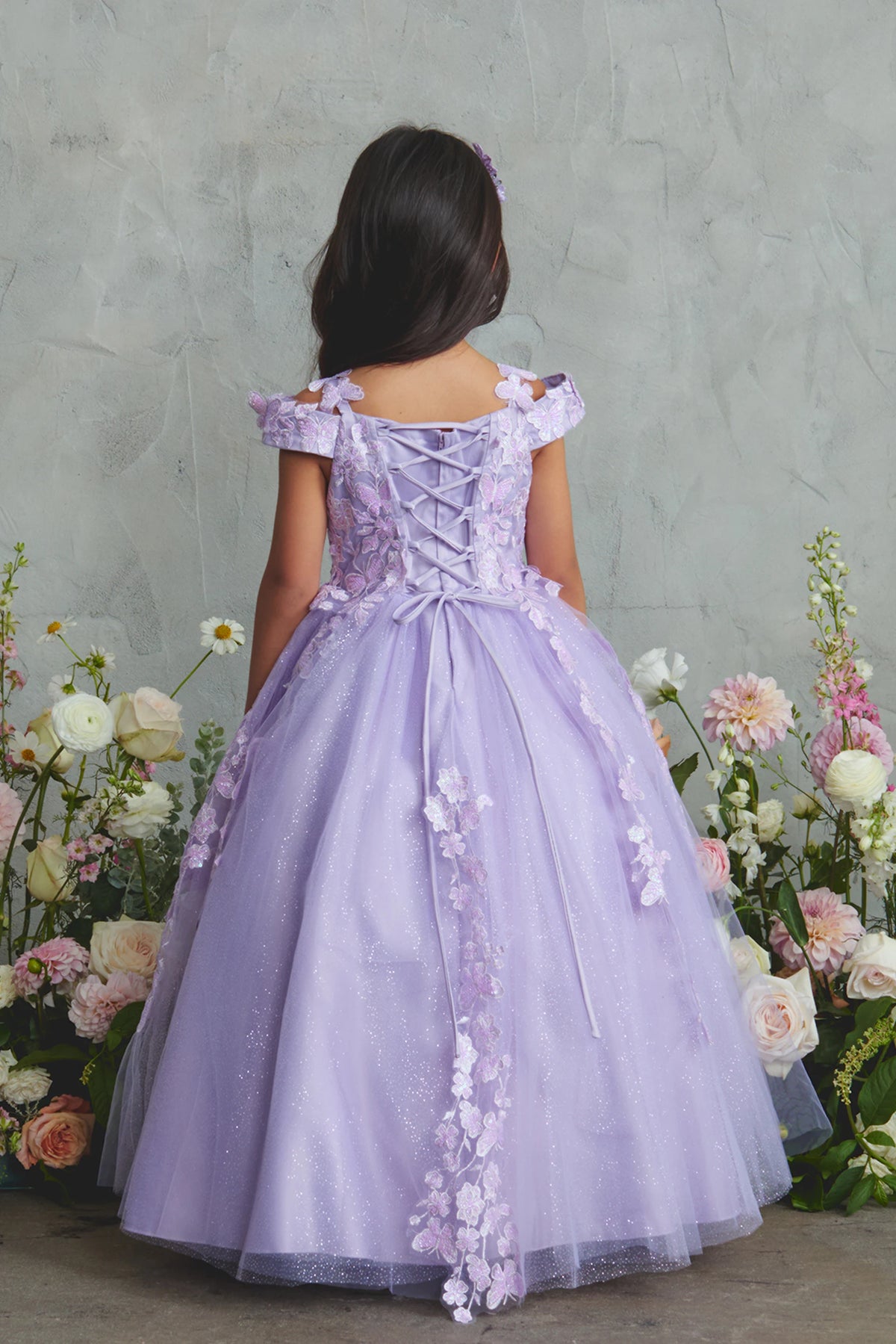 The Lilac kids pageant dress has lace-up ties at the back.