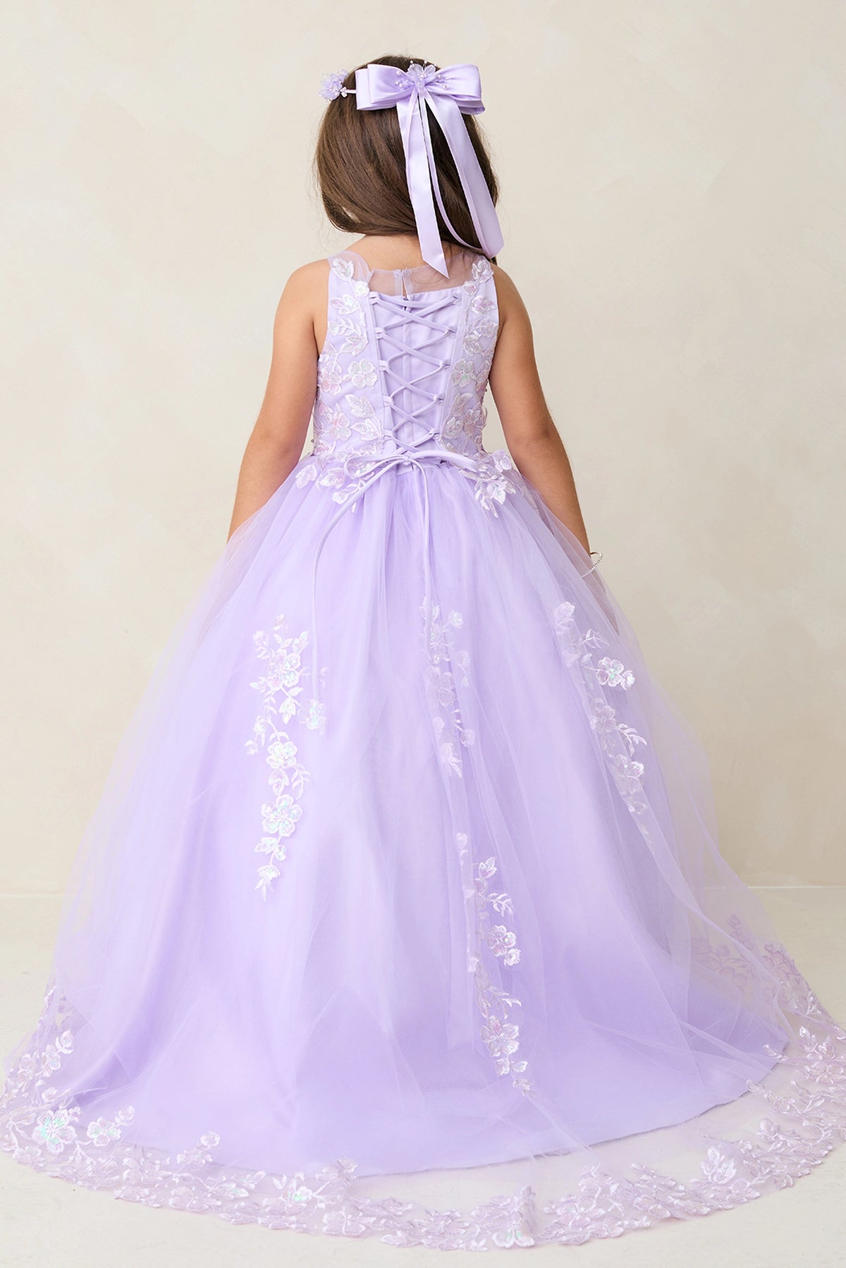 Lilac kids pageant dress featuring lace-up ties at the back.