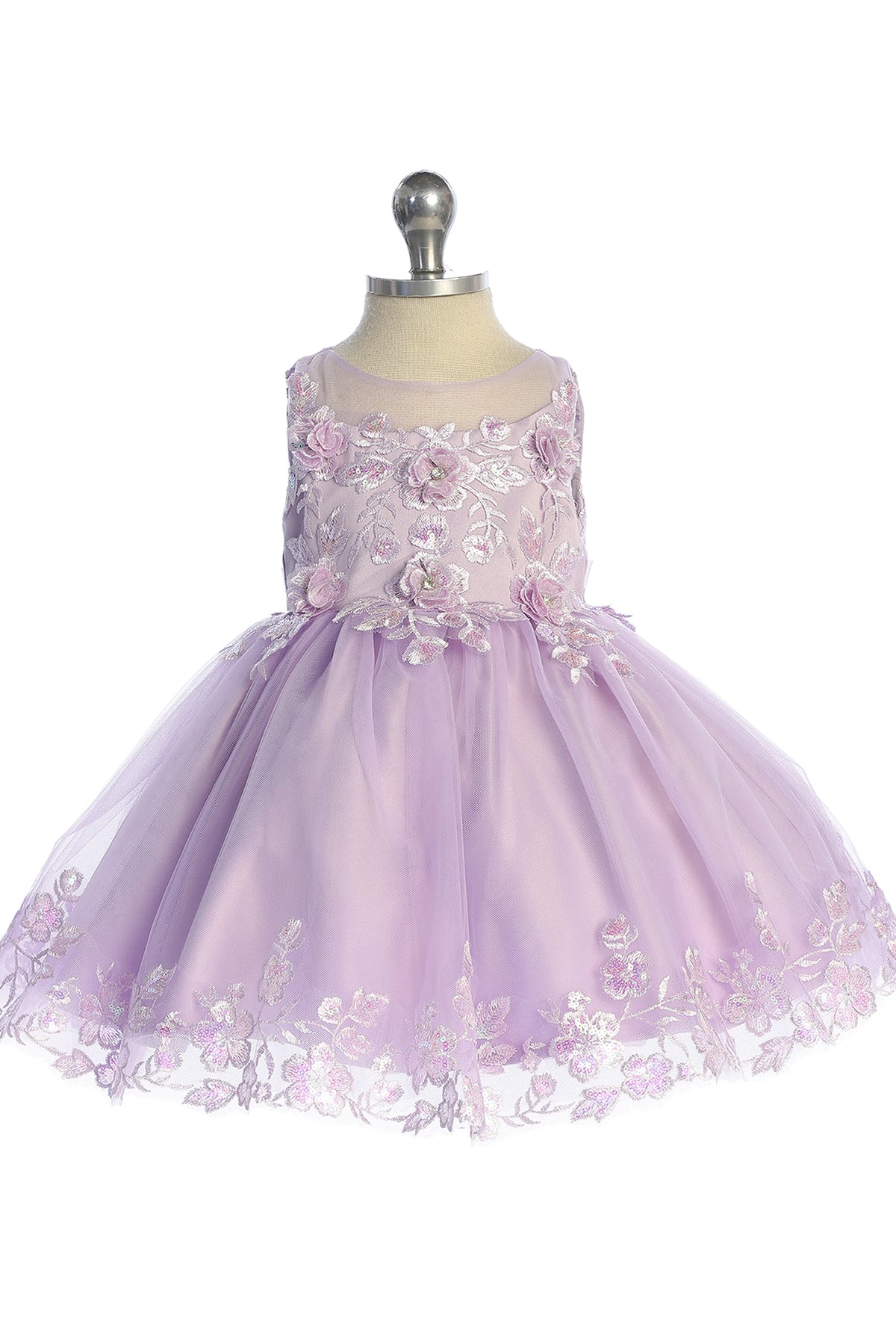 Seen from the front, this Lilac kids pageant dress displays lace appliques across the bodice and skirt.