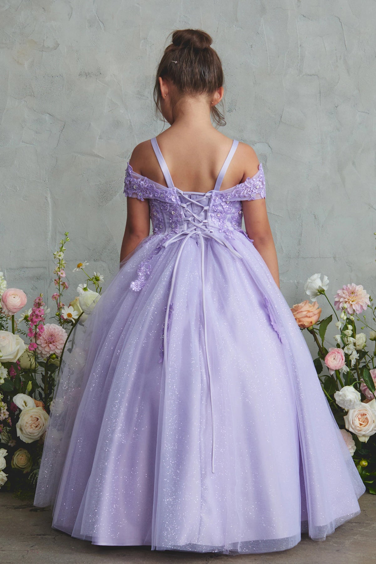 The Lilac kids pageant dress has lace-up ties at the back.