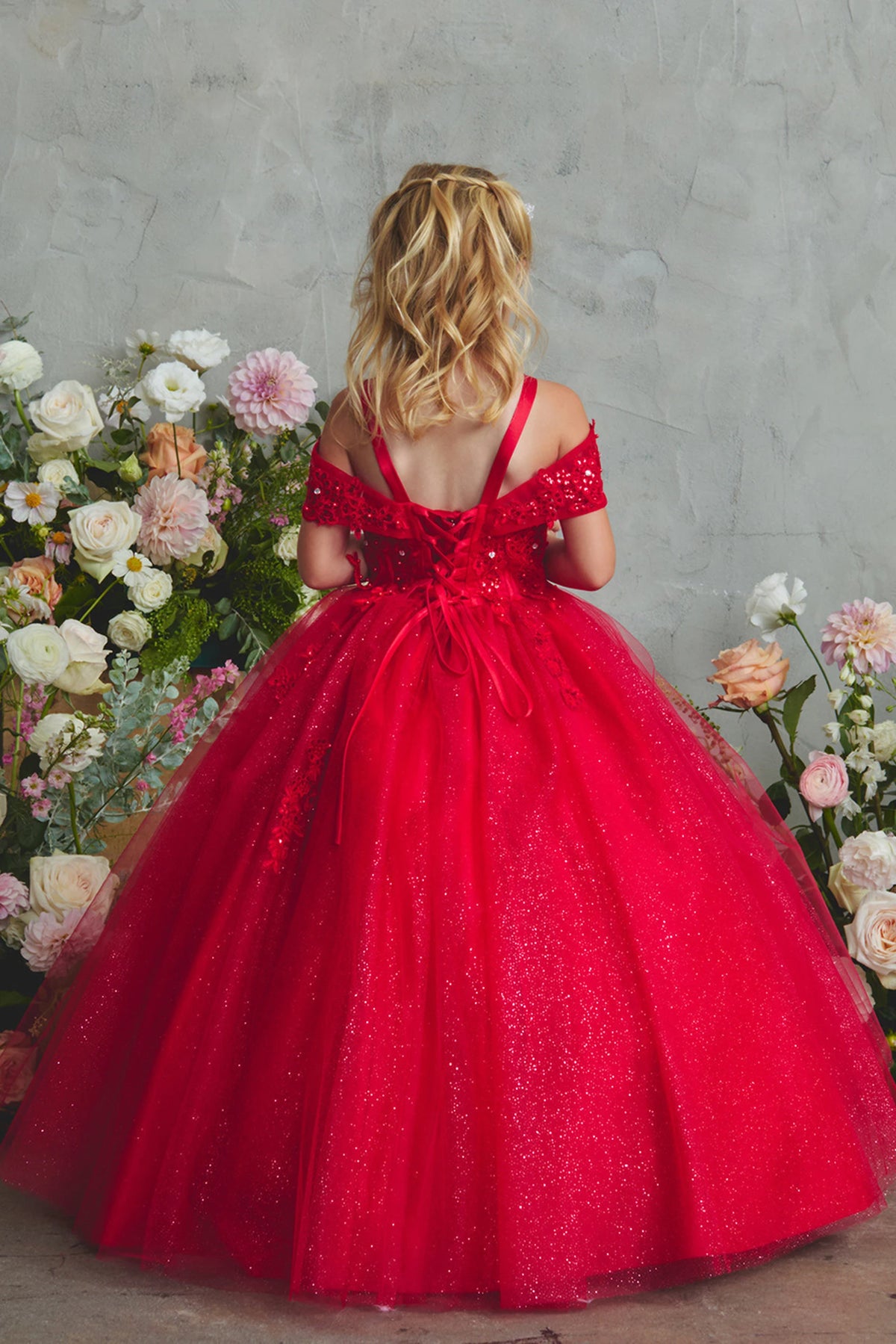 The Red kids pageant dress has lace-up ties at the back.