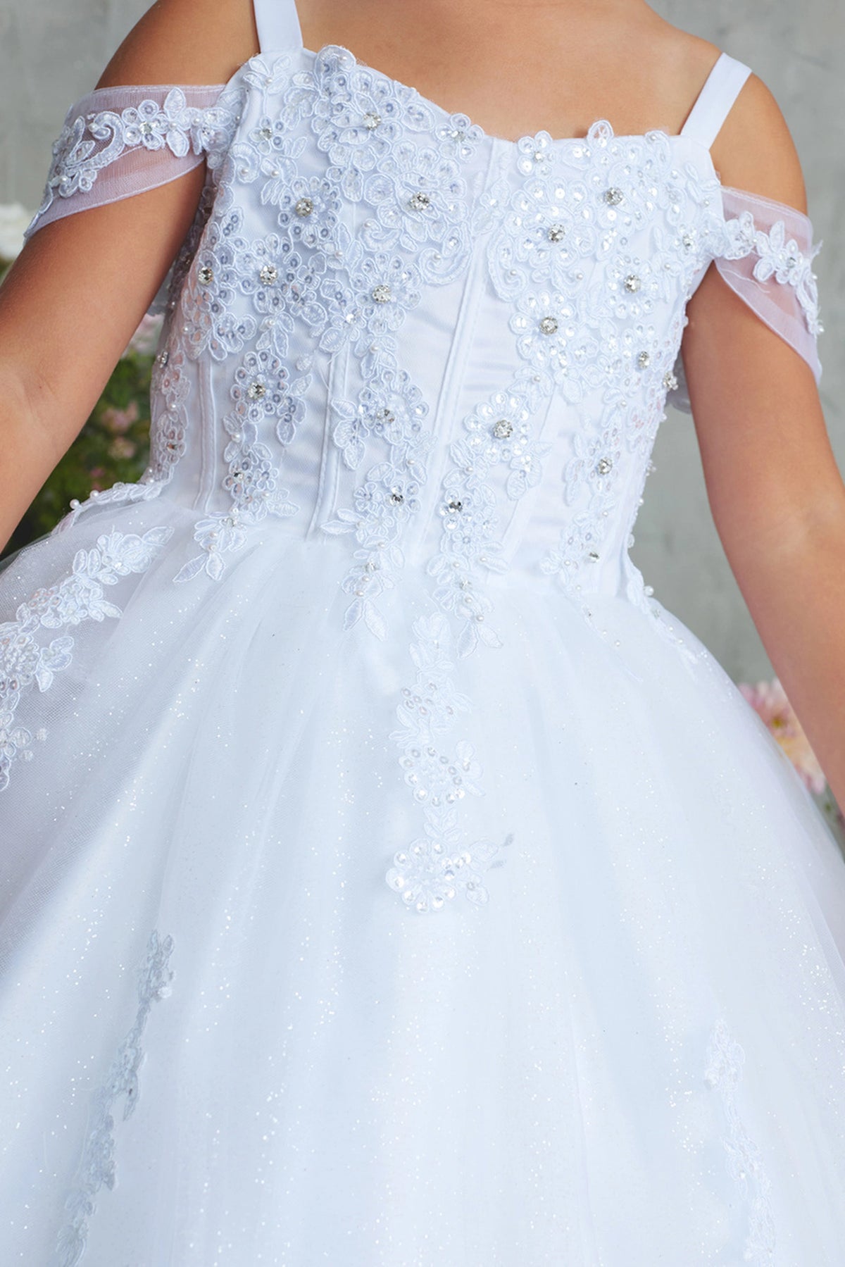 Another view of the White kids pageant dress shows lace appliques below the back waist.