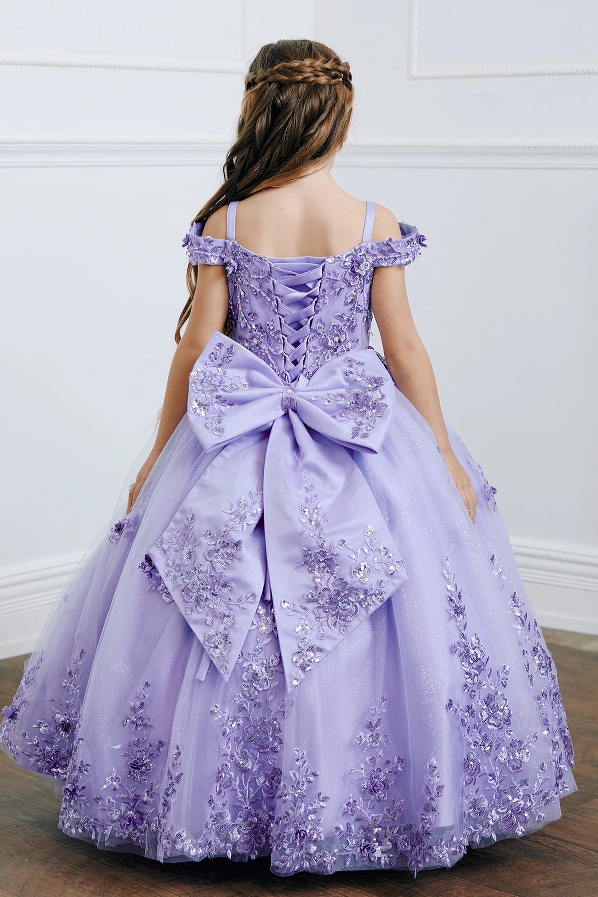 The Lilac kids pageant dress has lace-up ties at the back.