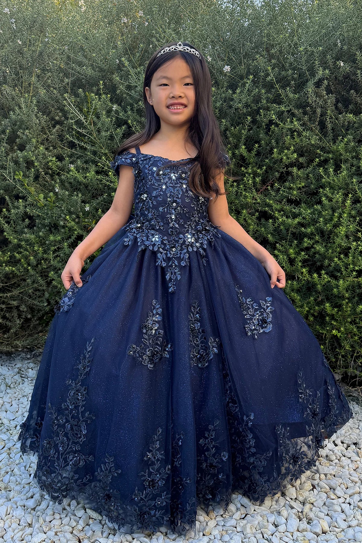 Navy Blue kids pageant dress featuring lace appliques on a glitter tulle skirt.