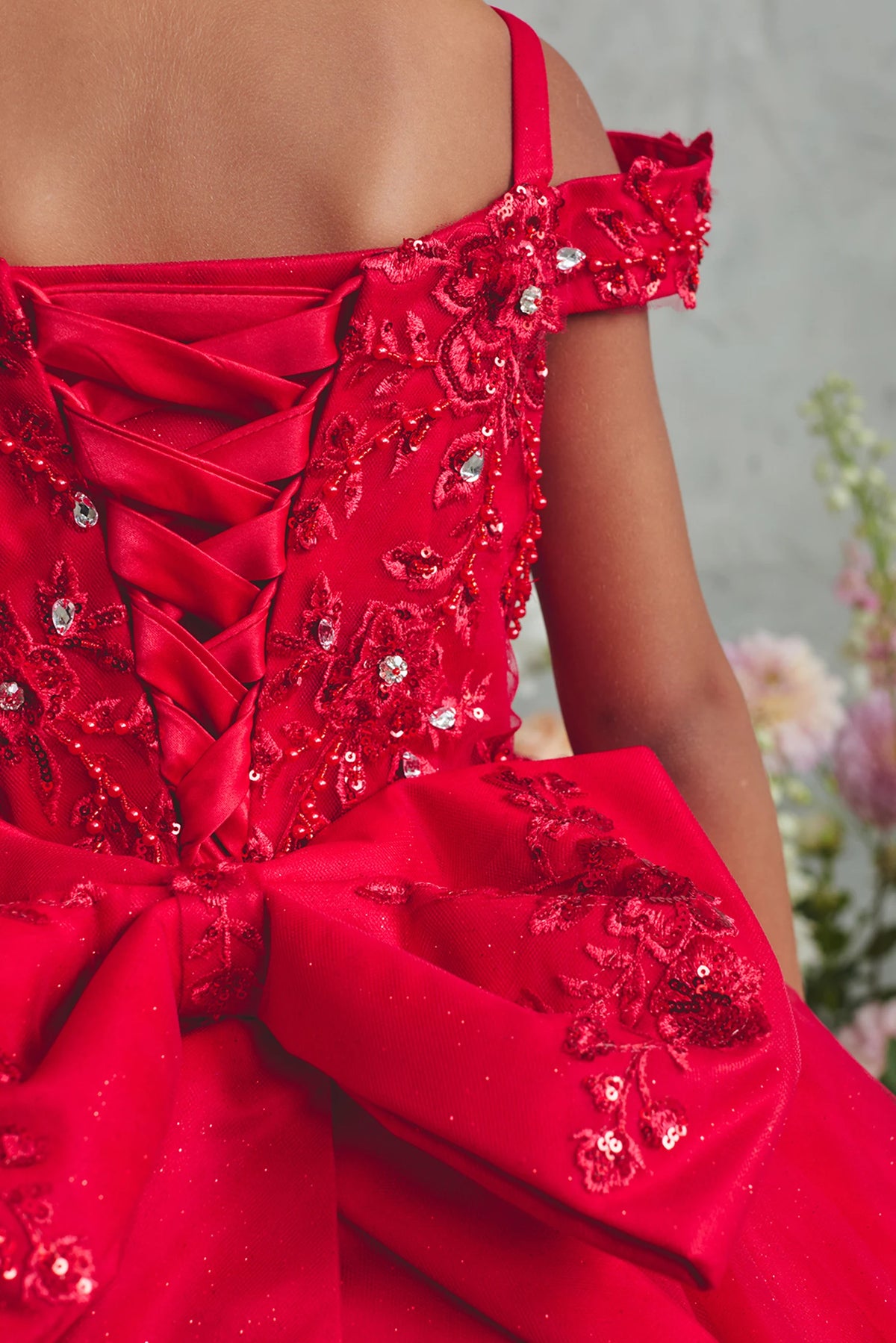 Visible details on the Red kids pageant dress include a rhinestone-trimmed lace neckline.