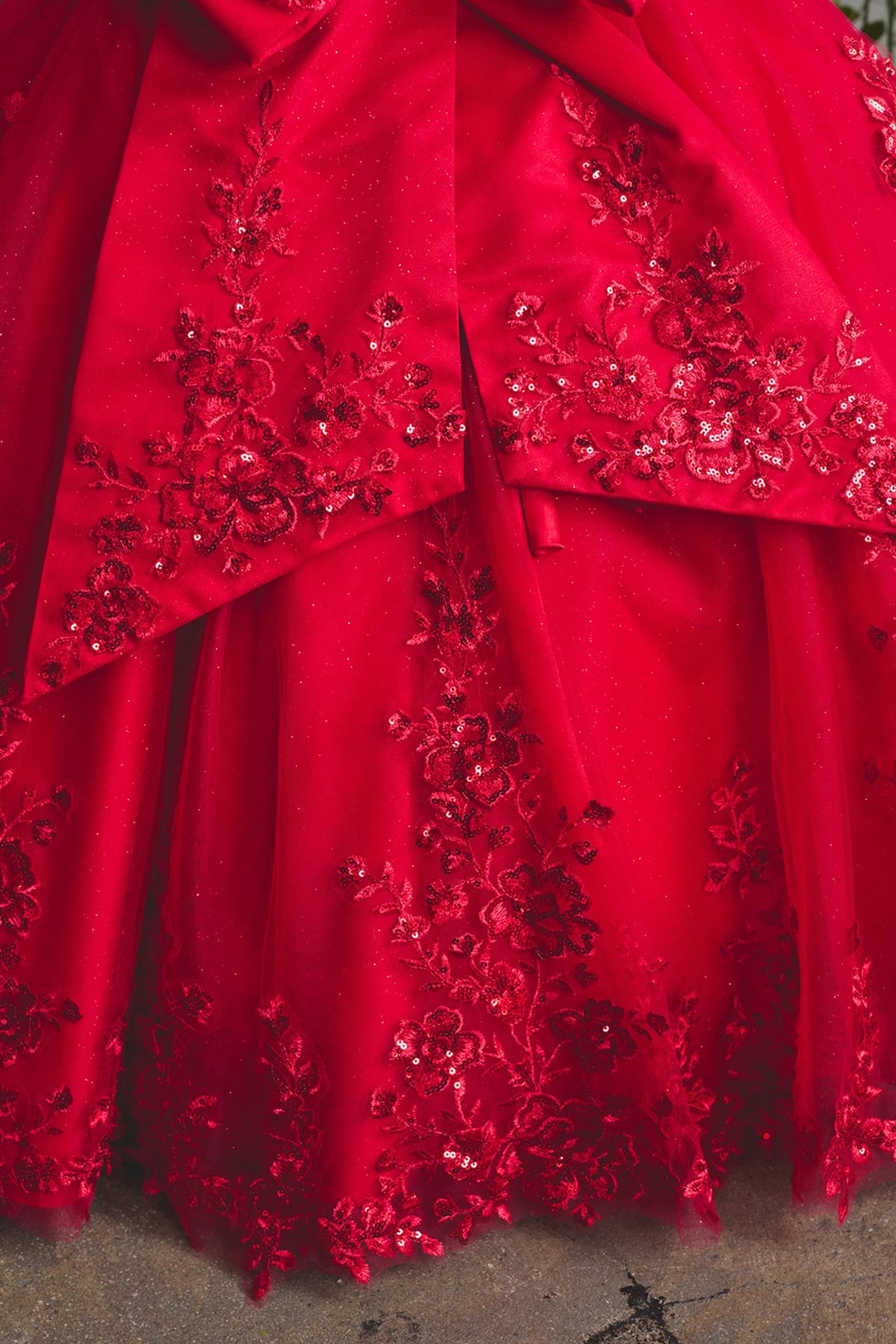 Another view of the Red kids pageant dress shows lace appliques over the skirt.
