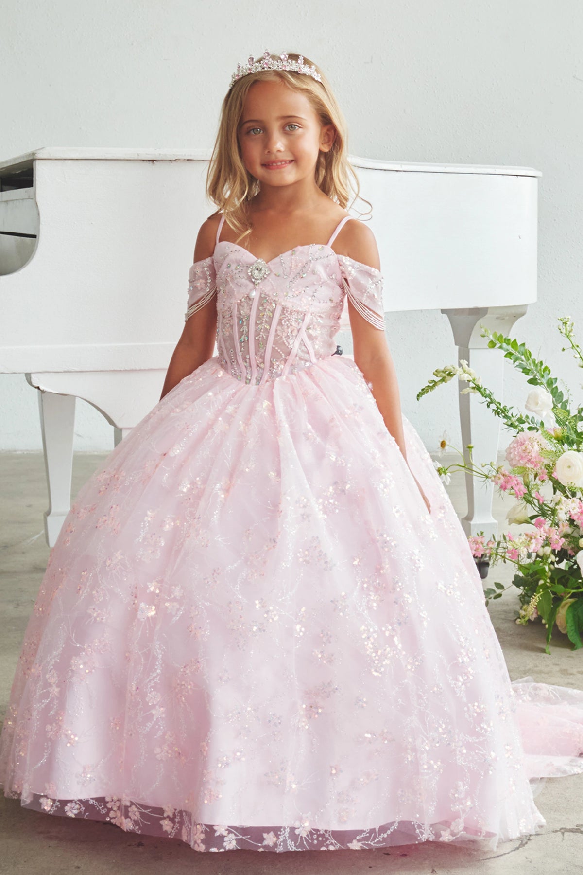 Another view of the Pink kids pageant dress shows beadwork over sheer bodice panels.