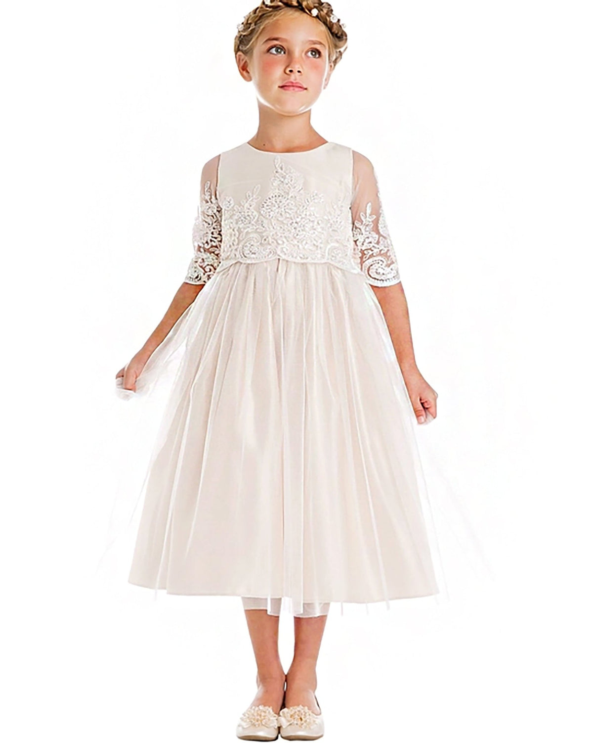 A white lace flower girl dress. Also suitable as a communion dress.