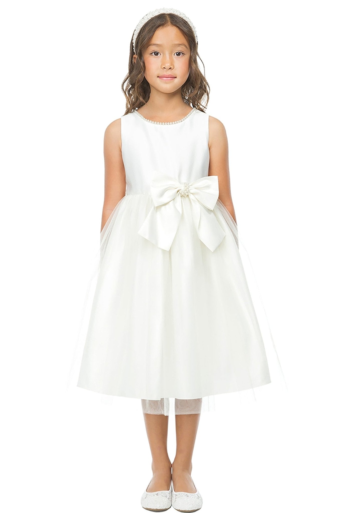 A Ivory flower girl dress with a large bow.